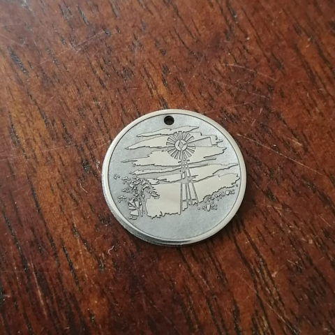 windmill 1 Laser engraving and marking on stainless steel pendant